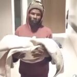 Video of a father holding a baby circulate on social media