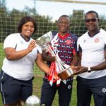 Agnus Elemu (middle) celebrate Namibia Premier League trophy with African staff membes