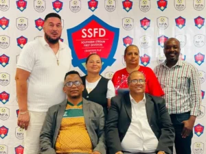 Standing, from left: Sebastian Lawrence, Suzel Cloete, Marilyn Klaaste and Likkius Elias. Seated: Andries Wimmerth (Deputy Chairperson) and Jakobus Murs Markus (Chairperson). Eric Wilmot of DTS FC was not pictured | Image credit: Phantom Connexion Media